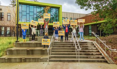 outside school with signs.png